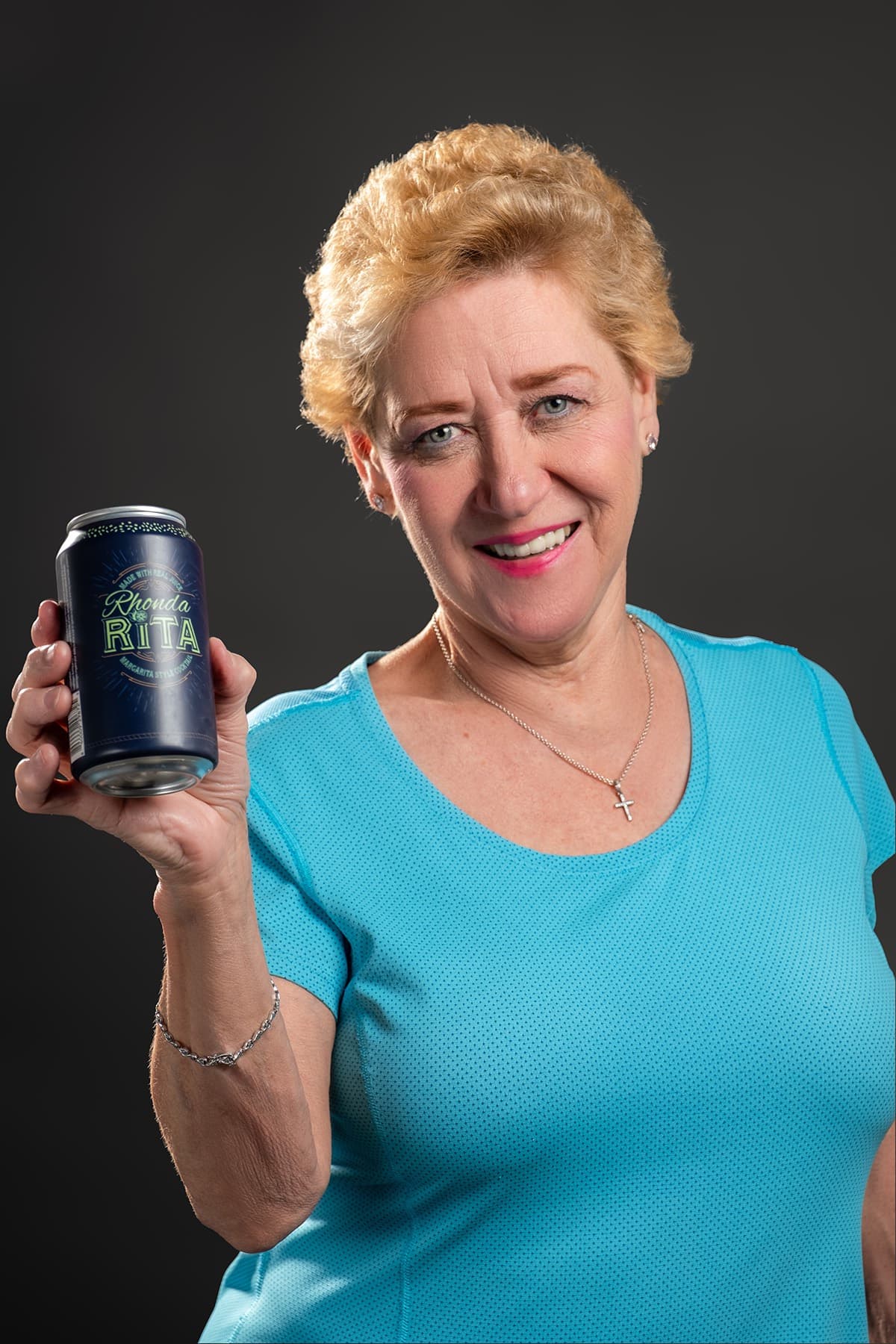 Rhonda Chapman holding a RhondaRita can